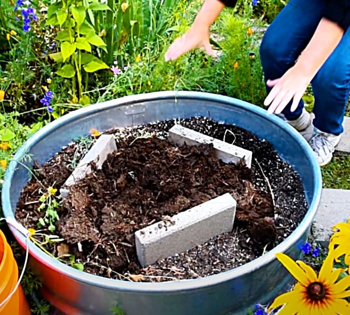 DIY Stock Tank Planter With A Solar Fountain