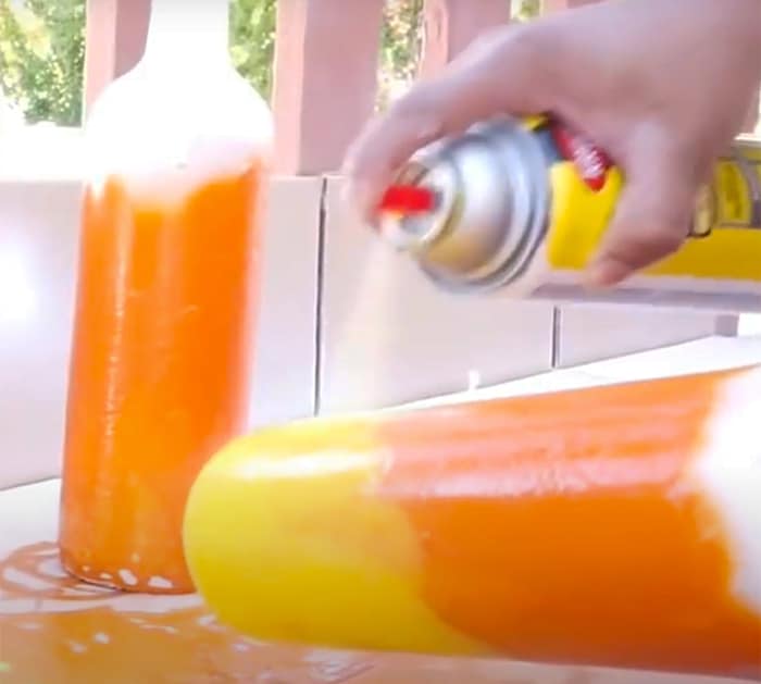 Spray Paint Wine Bottles To Make Candy Corn Decor - DIY Halloween Decor - DIY Candy Corn Ideas