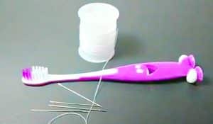 How To Thread A Needle Using A Toothbrush