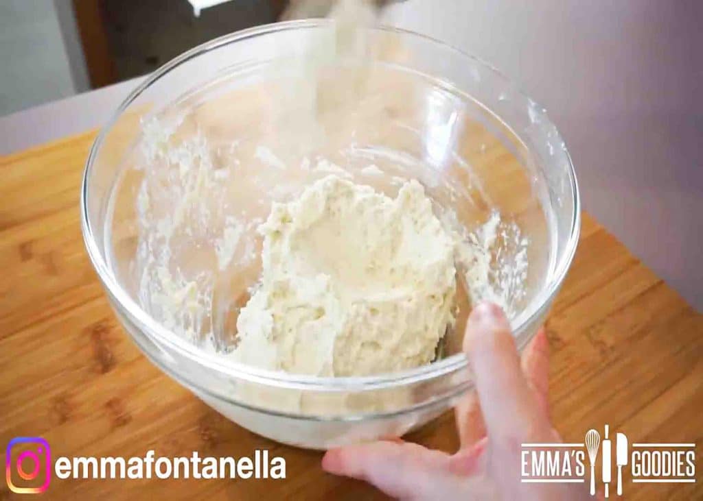 Mixing the self-rising flour and yogurt into a bowl