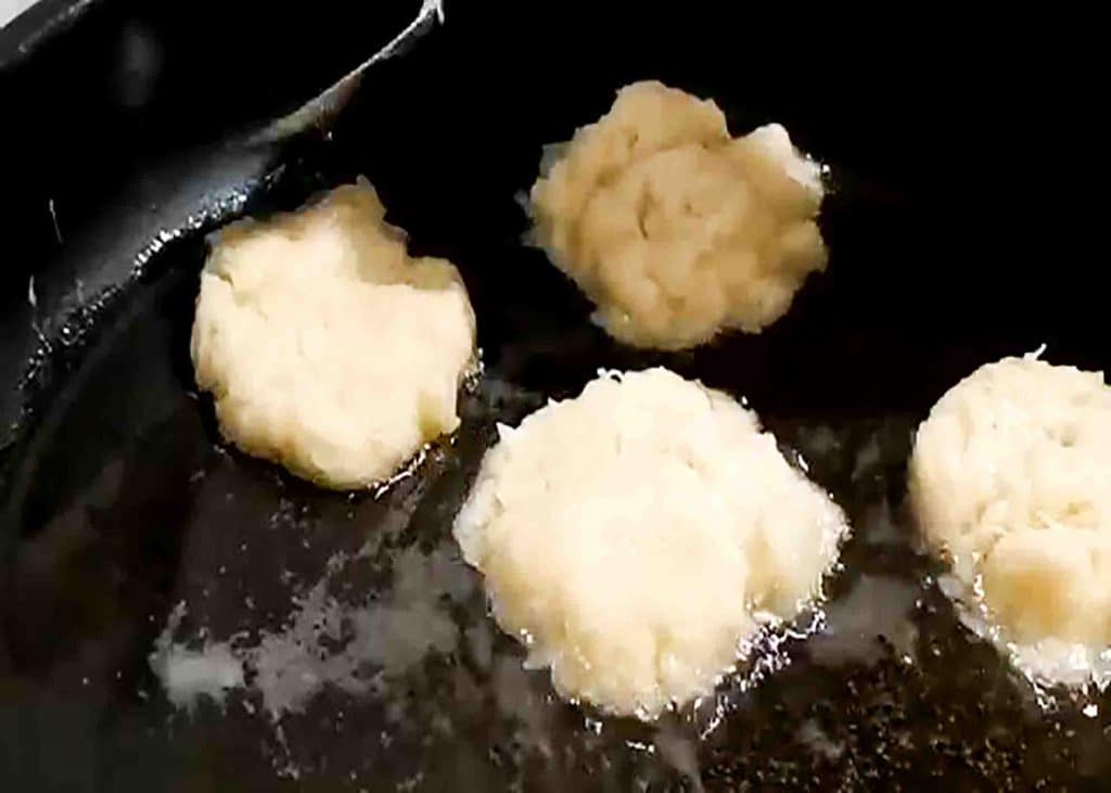 Frying the potato pancakes in medium heat
