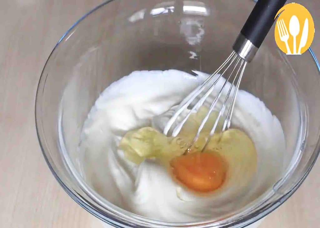 Mixing the yogurt and eggs for the yogurt cake