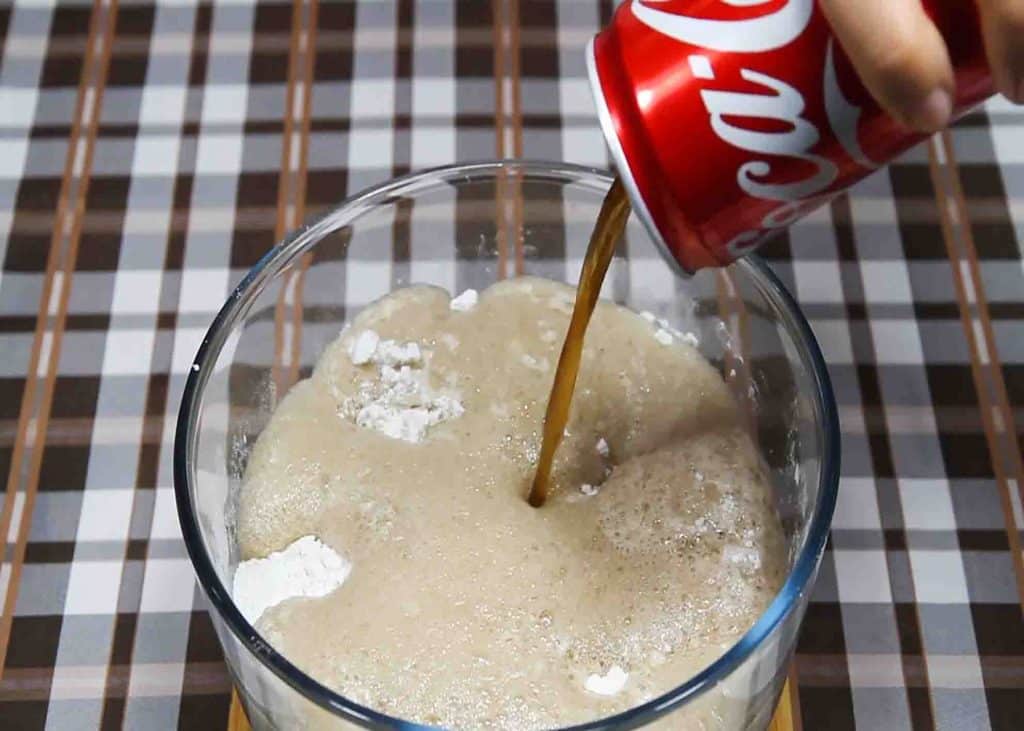 Adding Coca-Cola into the flour mix