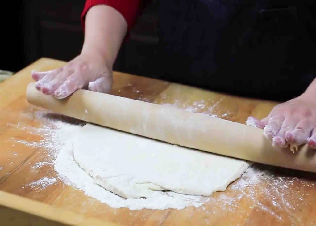 Rolling the dough for the cracker barrel dumplings