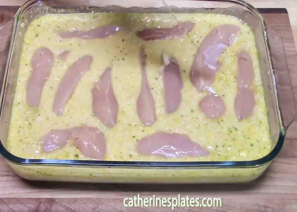 Laying down the chicken tenders into the casserole dish