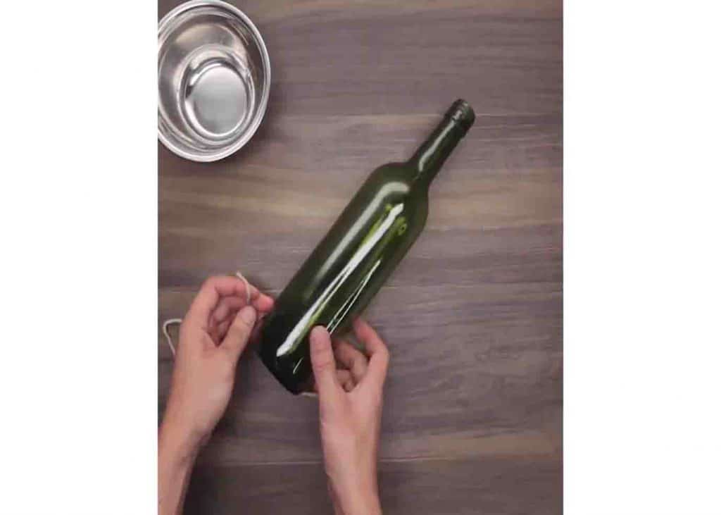 Cutting the bottom of the wine bottle