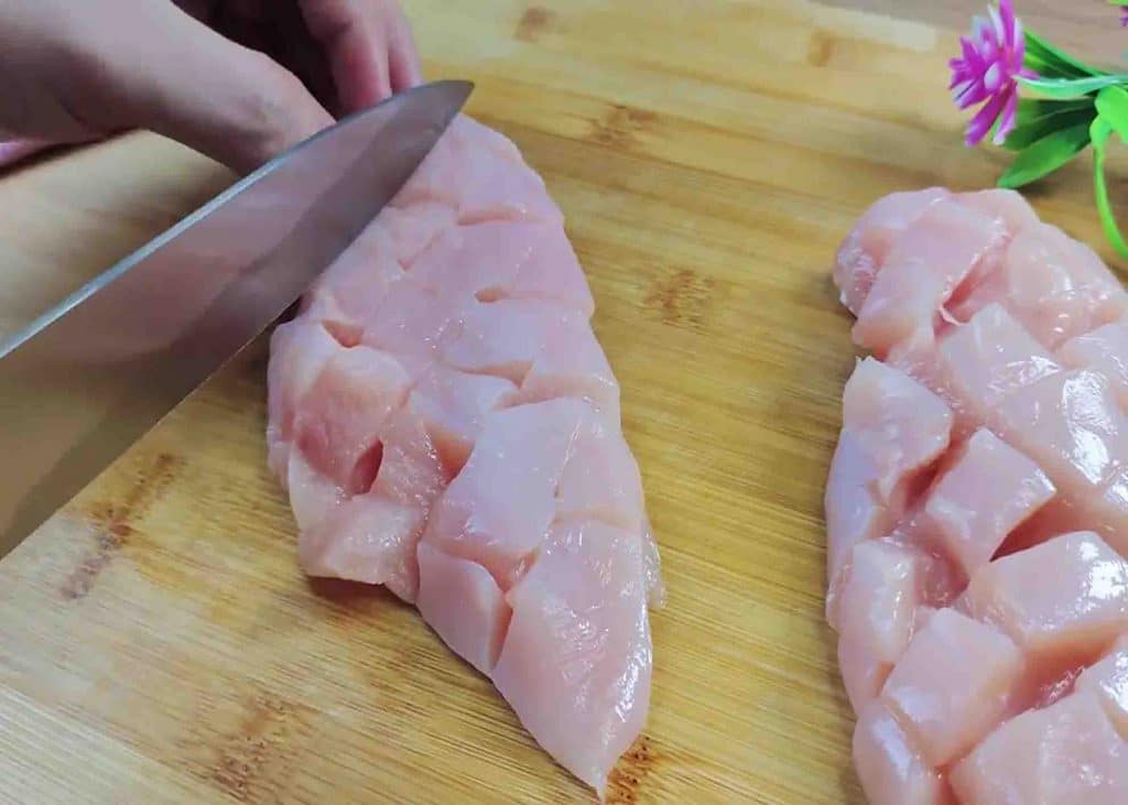 Crisscross cut across the chicken breasts for honey garlic chicken recipe