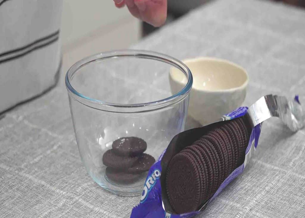 Separating the oreo cookie from its cream filling