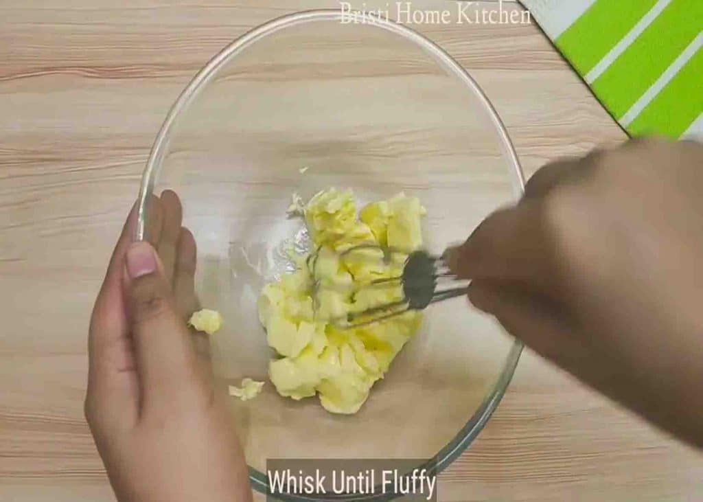 Whisking the butter until it becomes fluffy