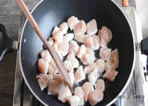 Sauteeing the chicken in a pan