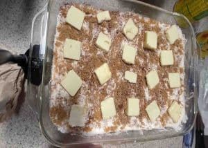 The peach cobbler dump cake is ready to go in the oven