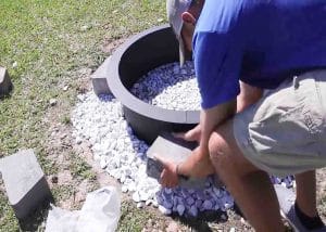 Stacking up the stones around the fire ring