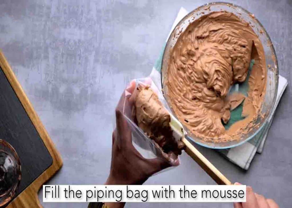 Filling the piping bag with the chocolate mousse