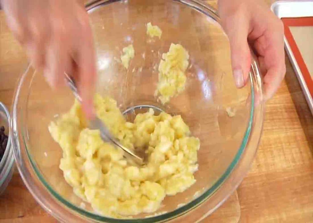 Mashing the banana for the banana oatmeal cookies