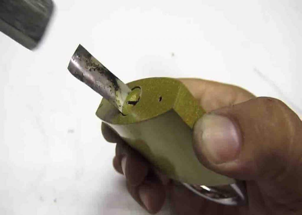 Unlocking a padlock using a small thin metal