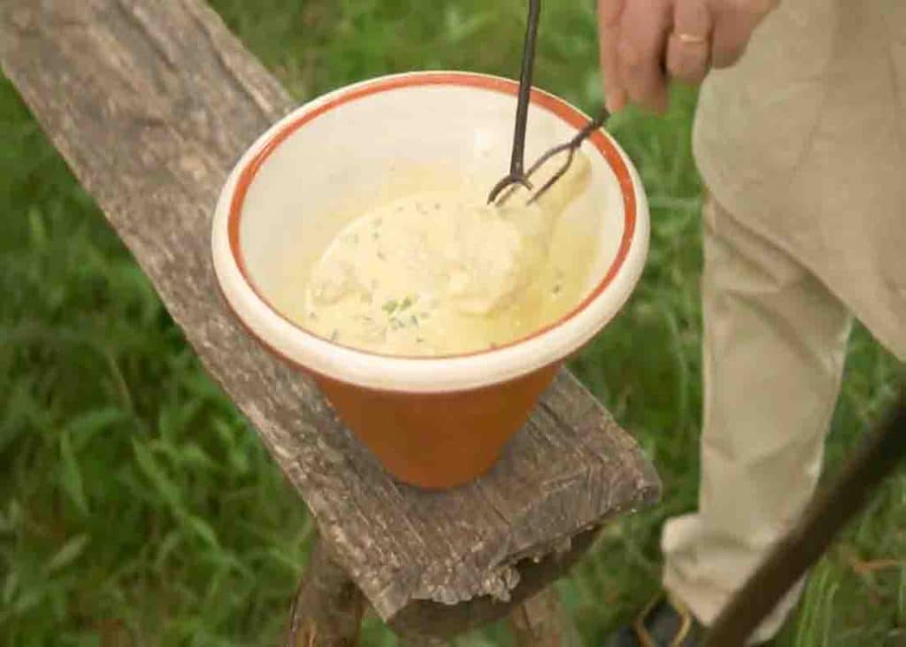 Dredging the chicken into the batter