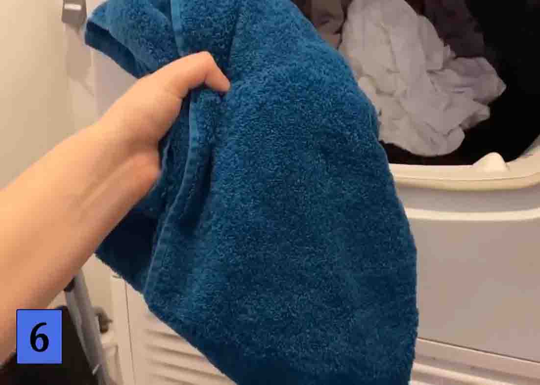 Add a dry towel when drying laundry in the dryer