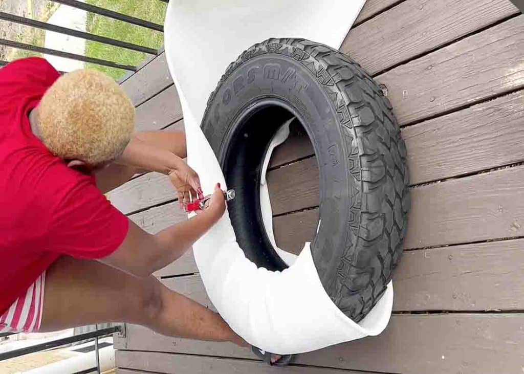 Wrapping the foam around the tire using a staple gun