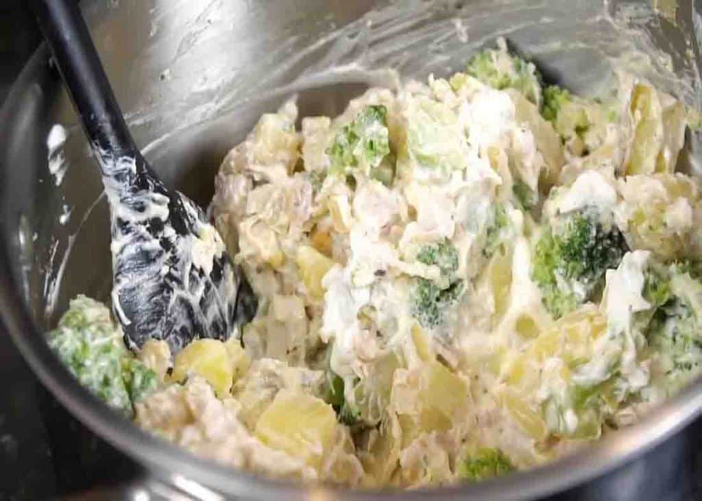 Mixing all chicken bacon ranch casserole ingredients