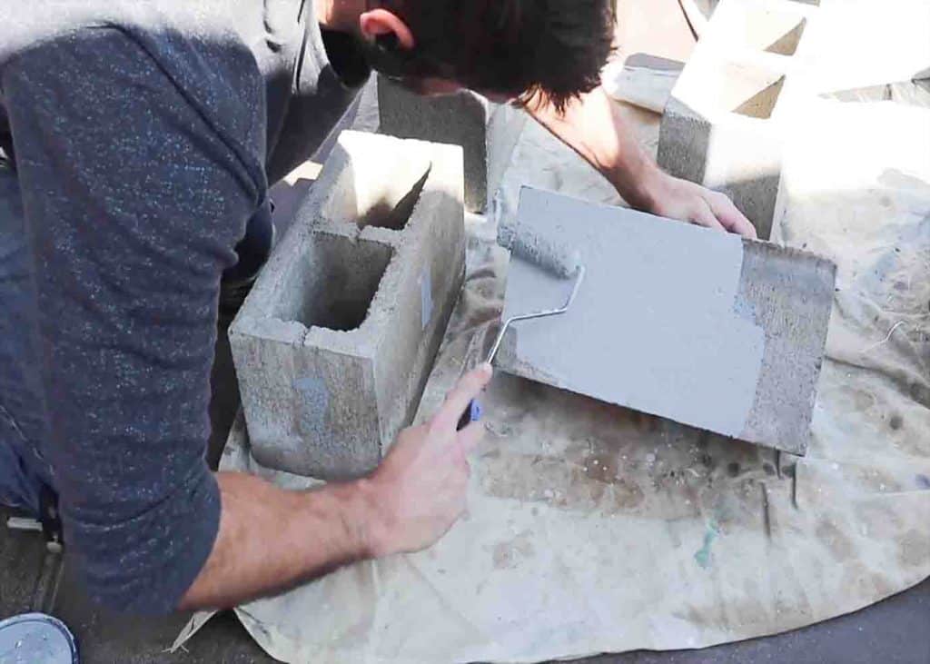 Assembling the base of the table which are the cinderblocks