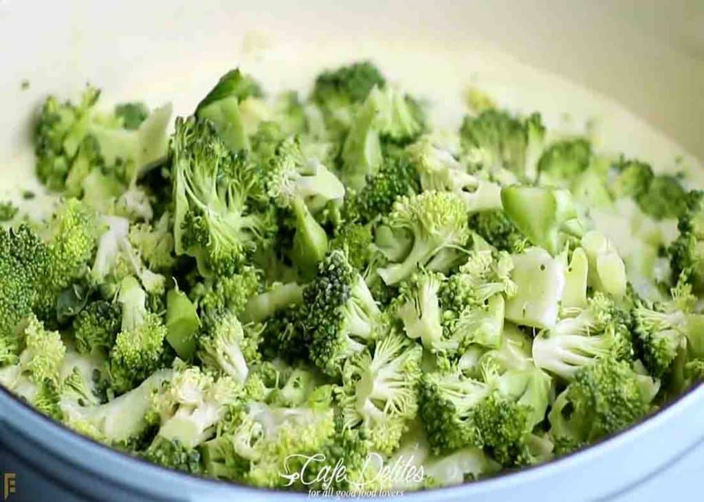 Adding the broccoli florets into the soup