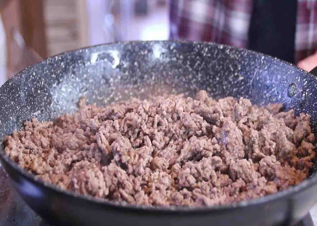 Cooking the lean ground beef for the cowboy casserole