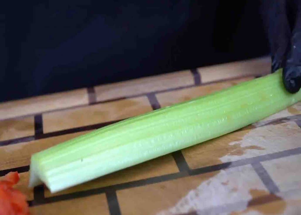 Dicing the celery for the seafood salad recipe