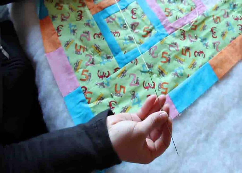 Doing the hidden stitch using a big needle