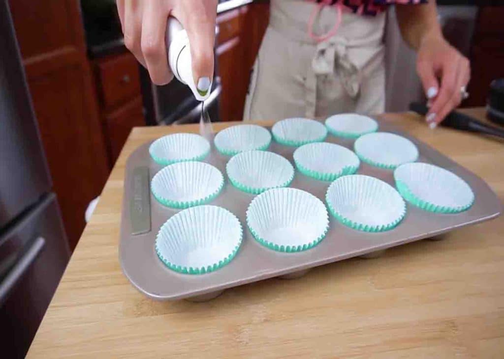 Spraying some nonstick oil to the cupcake liners