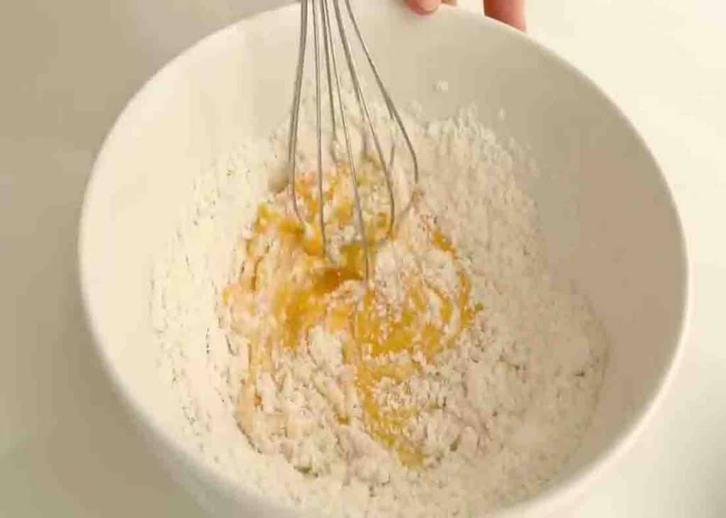 Mixing the yolk batter