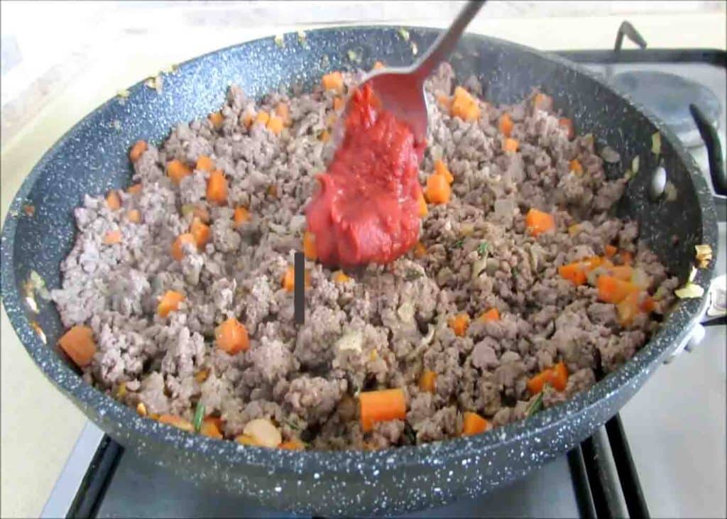 Cooking the meat mixture and adding the