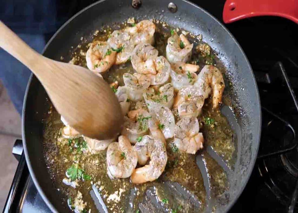 Cooking the shrimps for the shrimp and grits recipe