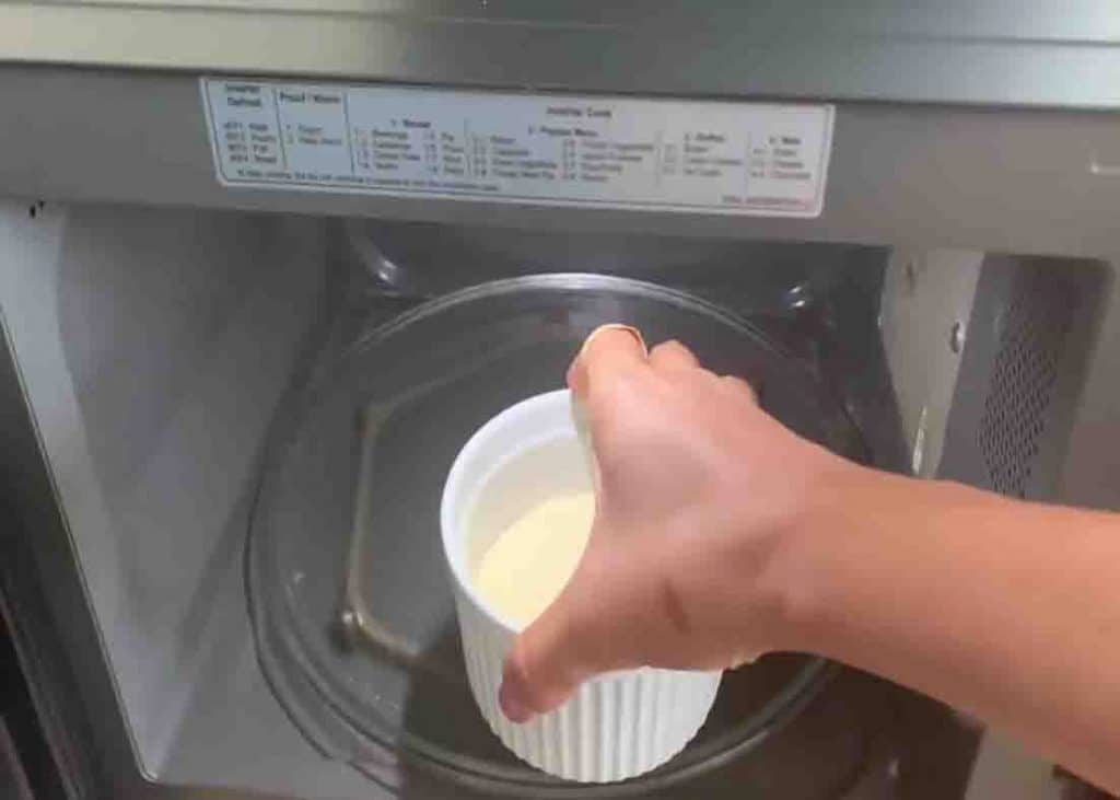 Putting the cheesecake mixture to the microwave