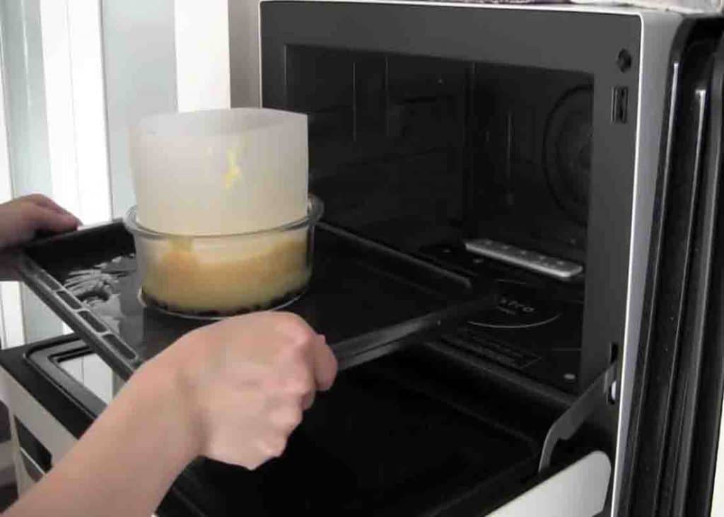 Placing the cake pan to the oven