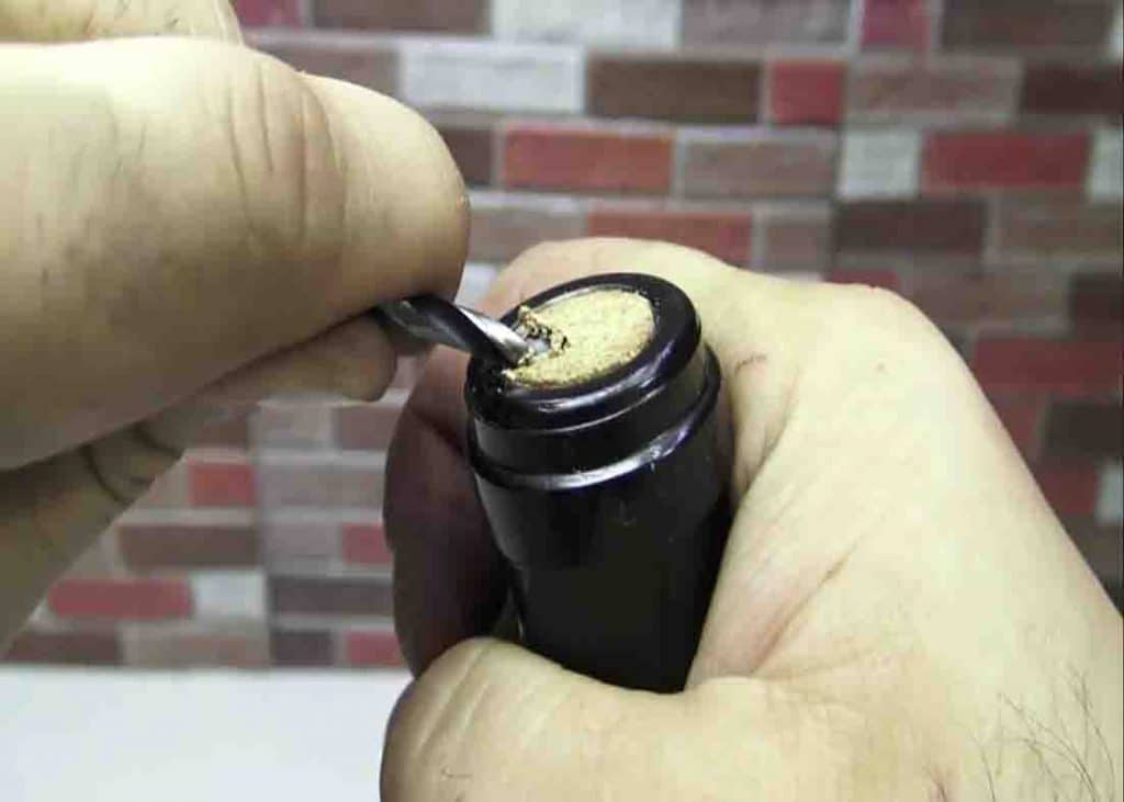 Use a drill bit to open the wine bottle