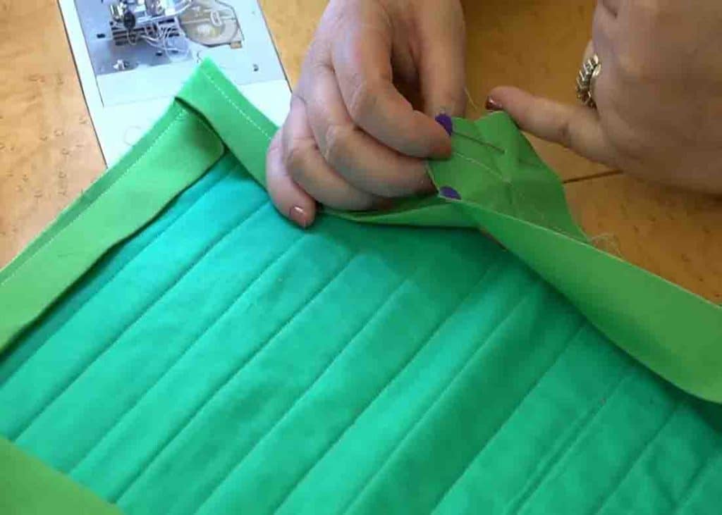 Sewing the ends of the binding