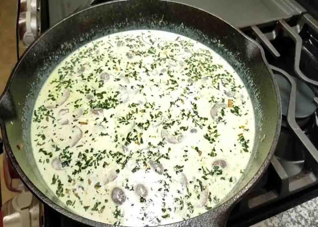 Making the creamy sauce for the garlic mushroom chicken