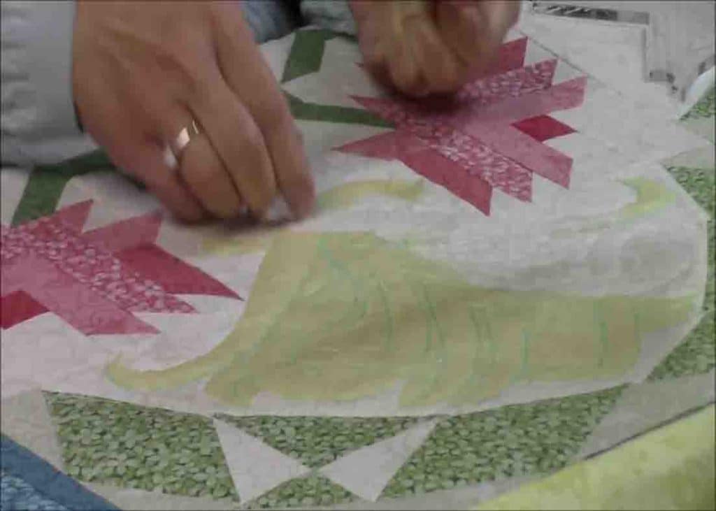 Removing the quilting paper from the quilt project
