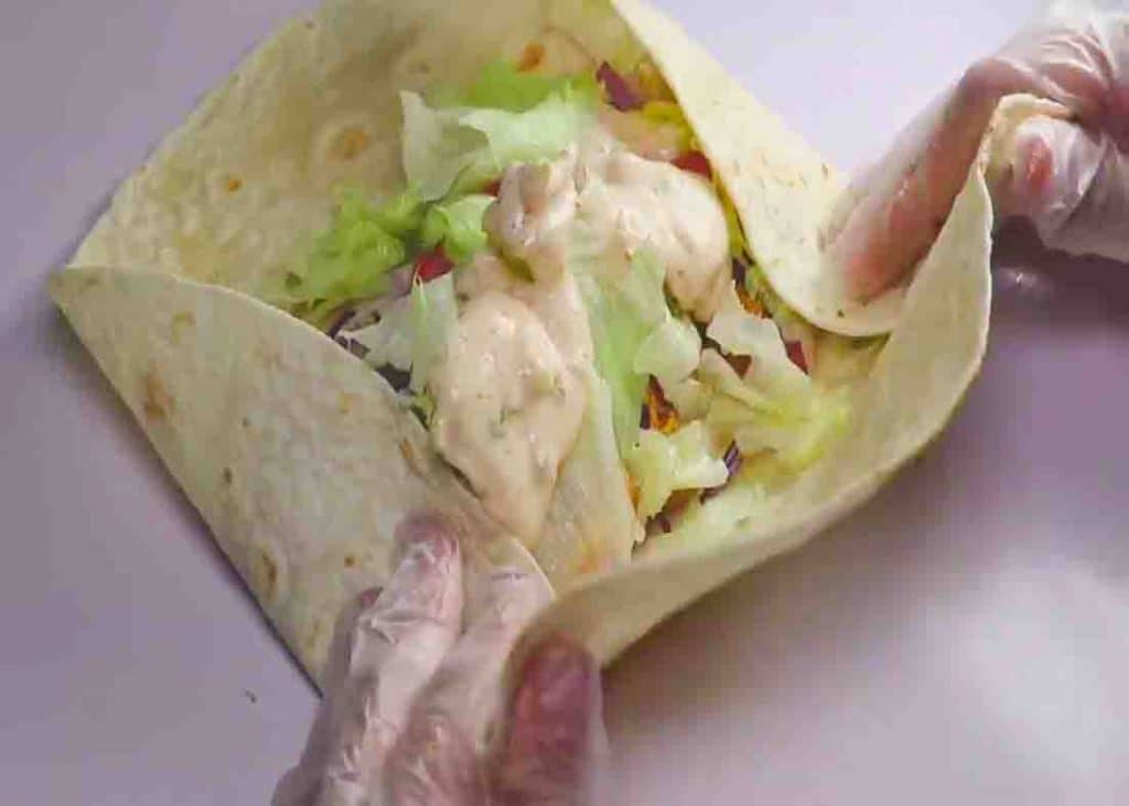 Rolling the chicken wrap