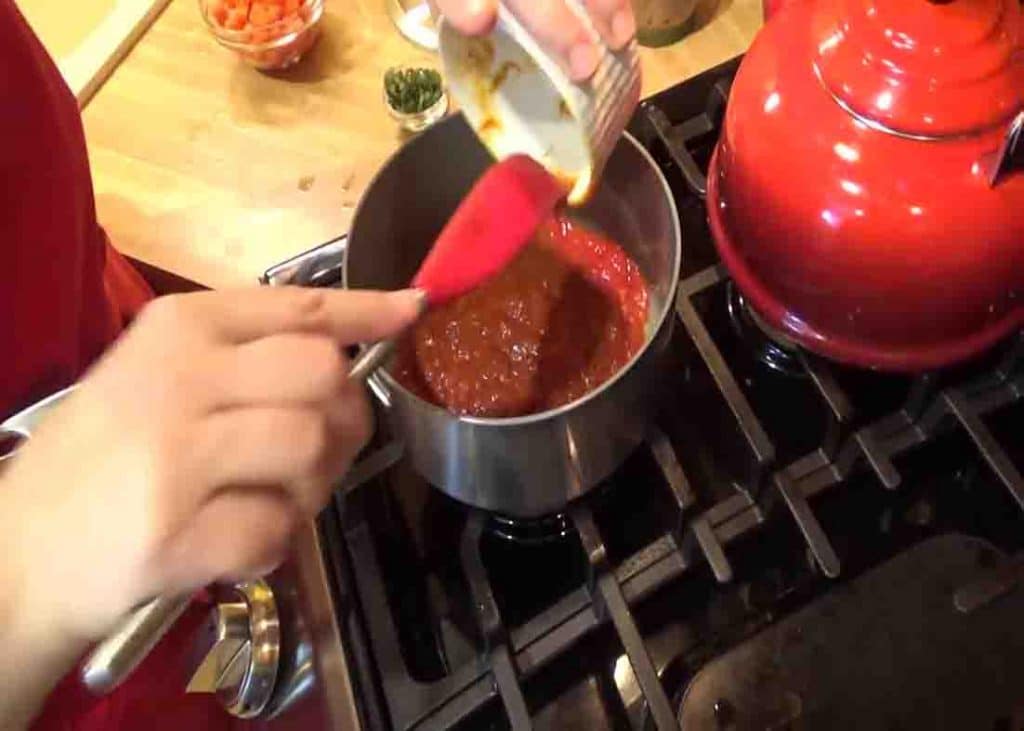 Making the sauce for the pizza casserole