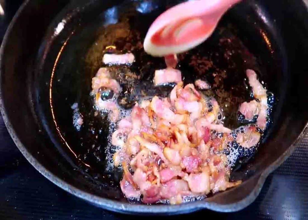 Frying some bacon for the pan-fried potatoes recipe