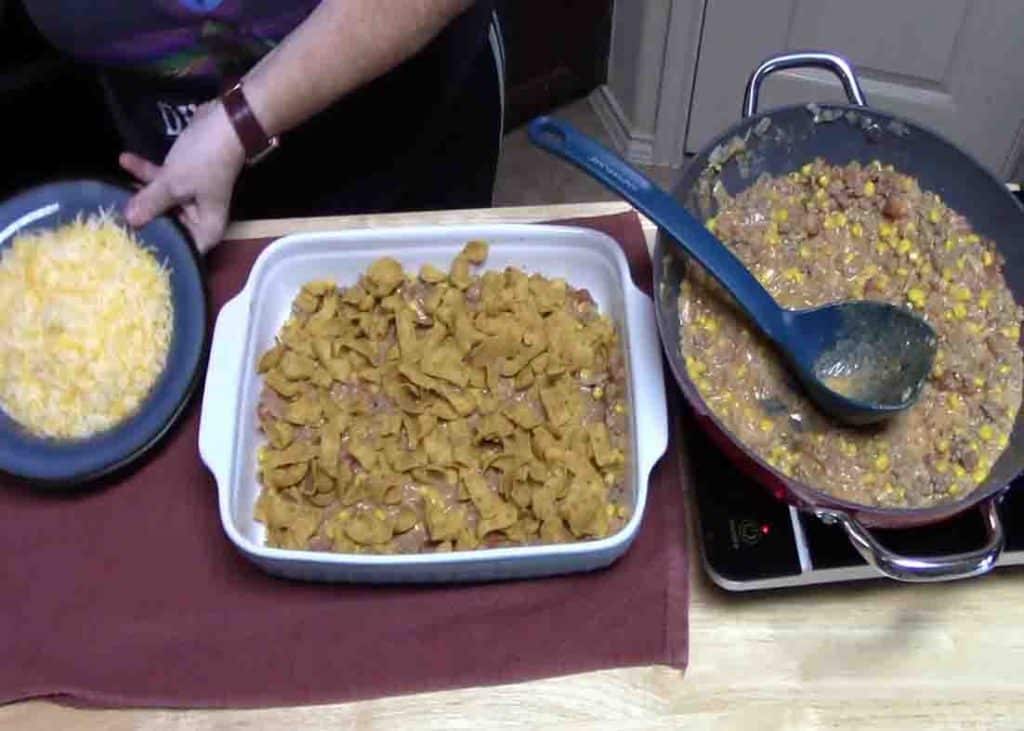 Assembling the frito pie casserole