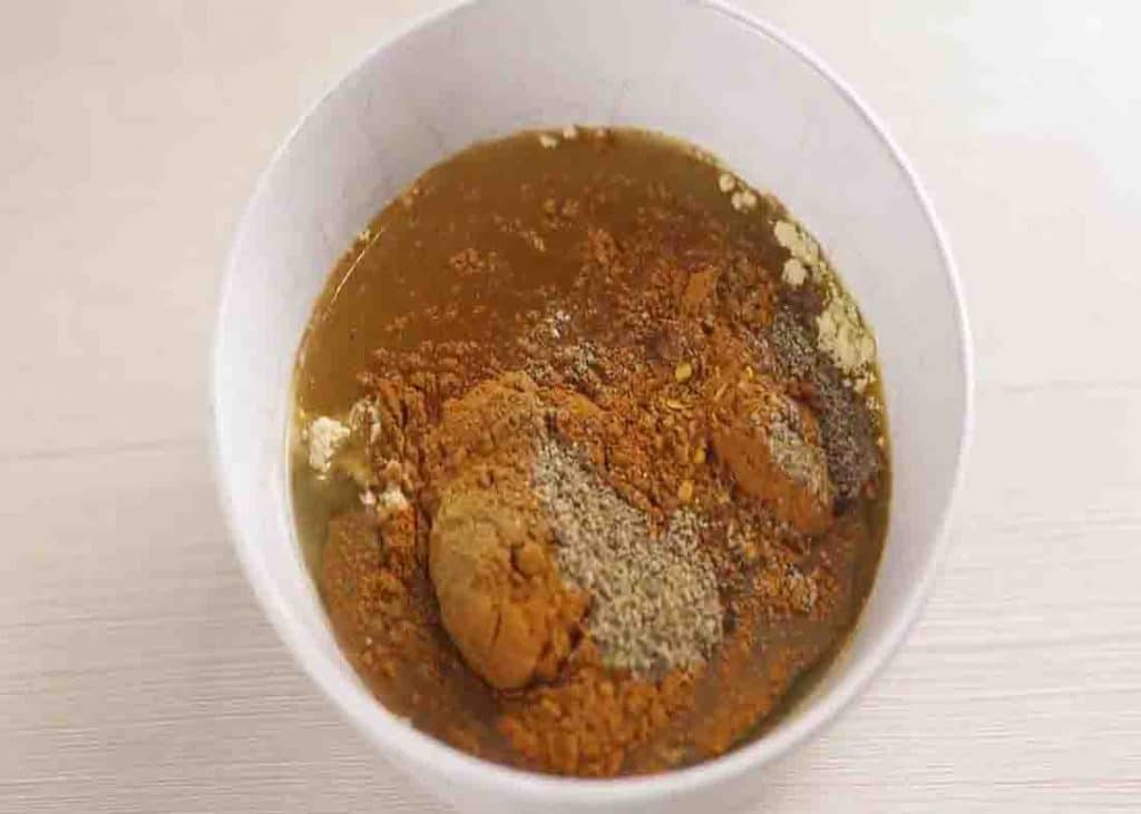 Combining all the spices for the marinade in a bowl