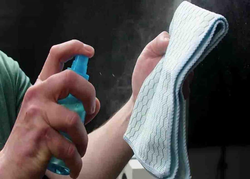 Use a spray bottle with water and a drop of dishwashing liquid to clean your TV
