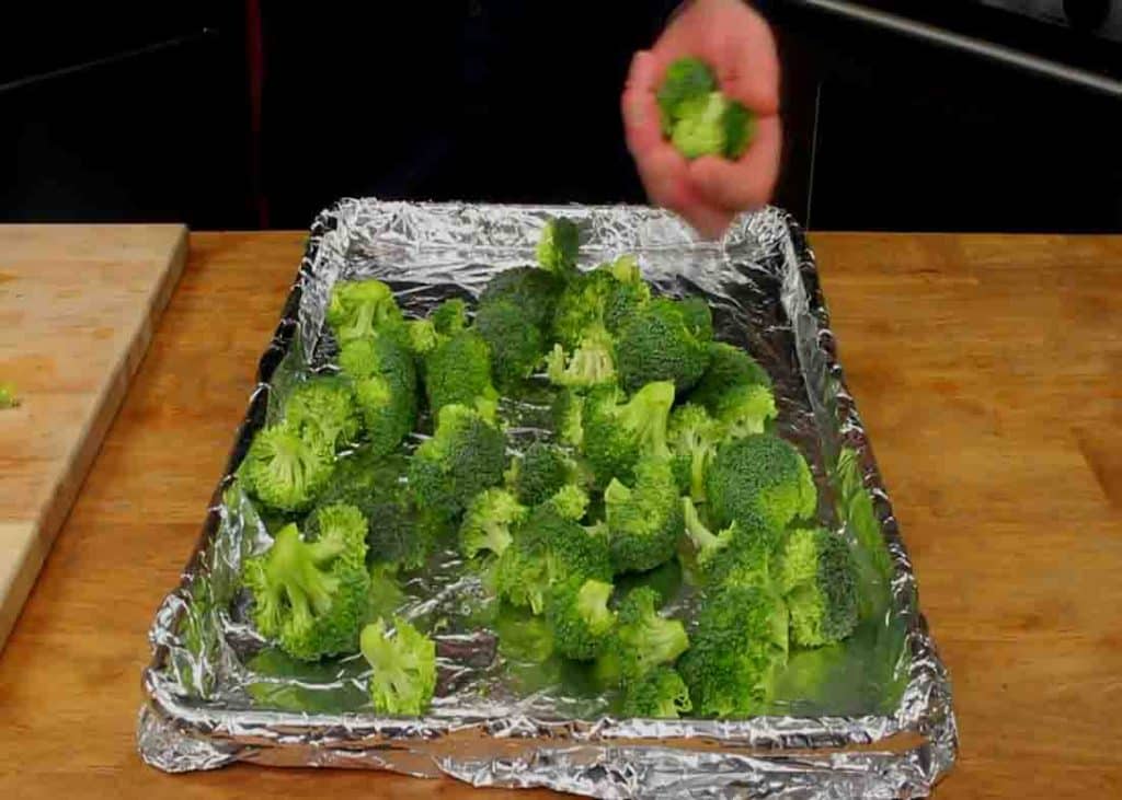 Spreading the broccoli to the lined sheet
