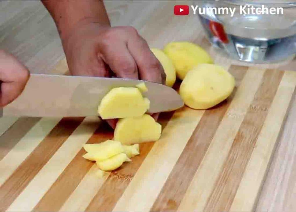 Dicing the potatoes into small pieces