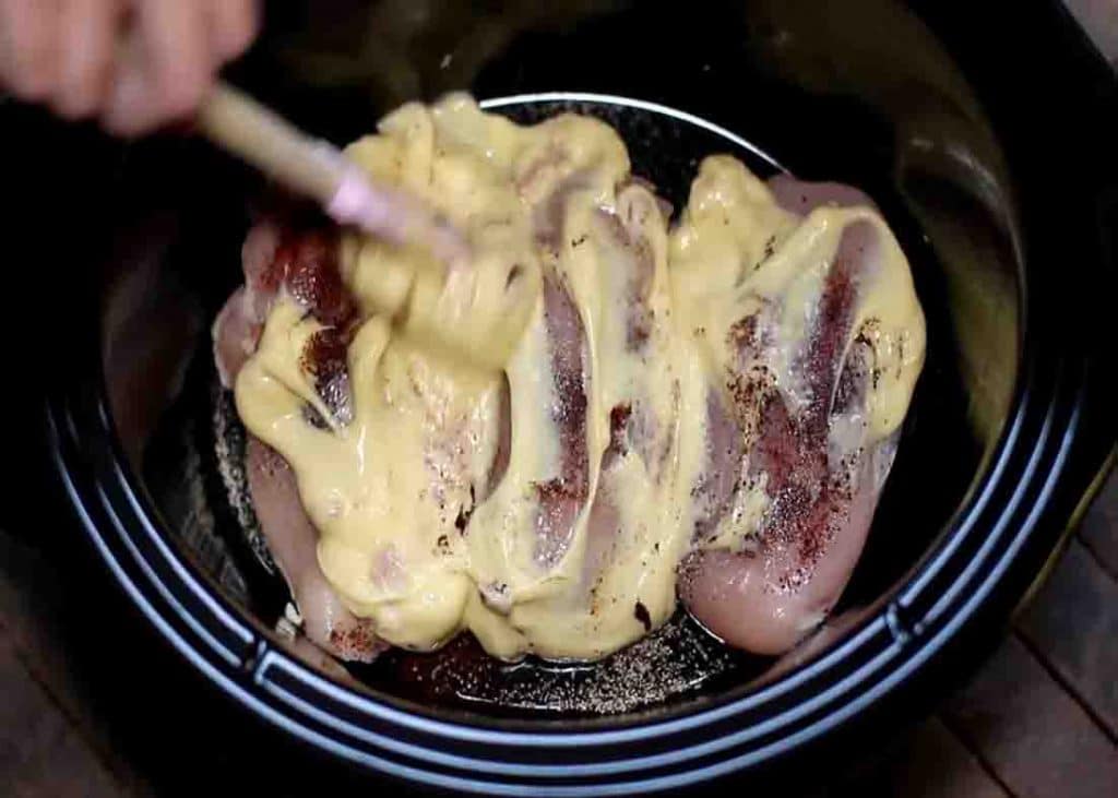 Adding cream of chicken to the slow cooker