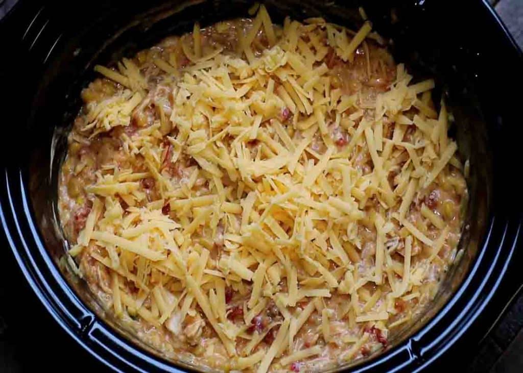 Adding cheese to the fiesta chicken and rice casserole