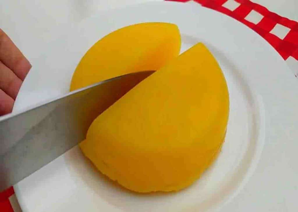 Slicing the orange cake for serving