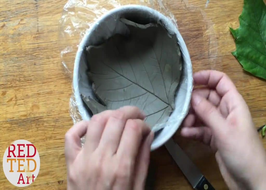 Shaping the leaf clay to the bowl